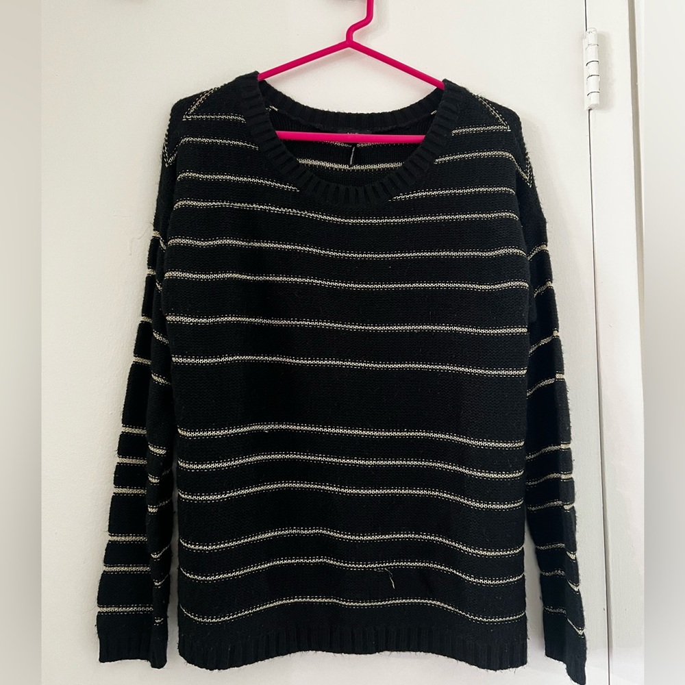 Black sweater with gold stripes